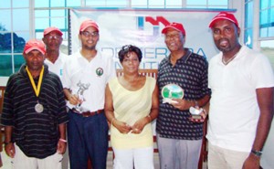George Bulkan (third left) poses with Public Relations Manager of Demerara Mutual Marjorie Chester, Maurice Solomon,(second right) Alfred Mentore,(right) Imran Khan (left) and Lusignan Golf Club President Mel Sankies. 