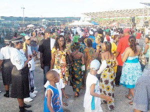 Throngs of Emancipation Day celebrants making their way into the National Park yesterday afternoon.