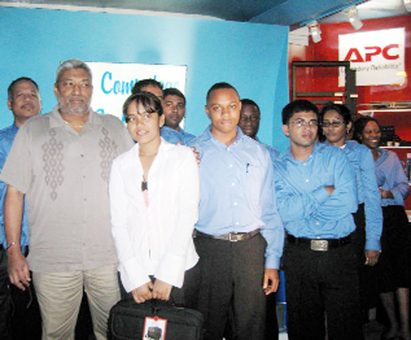 Shirvanie Persaud (second from left) with management and employees of the company.