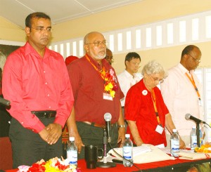 President Jagdeo, General Secretary Donald Ramotar, former President Janet Jagdeo and Home Affairs Minister Clement Rohee observe a minute’s silence in memory of slain Agriculture Minister Satyadeow Sawh at the PPP congress yesterday. (Photo by Jules Gibson)