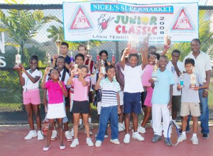 The winners’ and runners-up at the fifth annual Nigel’s Supermarket lawn tennis tournament. (Clairmonte Marcus photo)