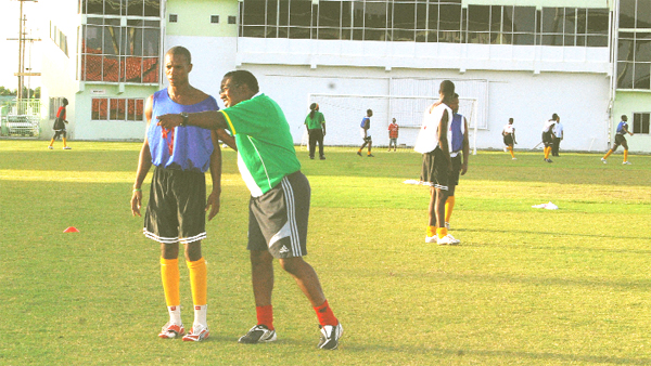 ‘AWO’ WE GO! Head Coach Jamaal Shabazz points Anthony `Awo’ Abrams in the direction that he and the Golden Jaguars team should be going in order to win Group `B’ of the  Digicel  Caribbean Cup and advance to the next round.  (Lawrence Fanfair photo)