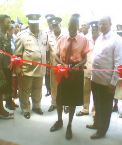  A student of the Felix Austin Training College cutting the ribbon