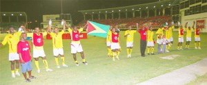 Thanks for your support!! Guyana’s Golden Jaguars say goodbye to the fans after their 1-1 draw with Suriname in the Digicel Caribbean Championship group B’ match at the Guyana National Stadium, Providence last night. (Lawrence Fanfair photo)