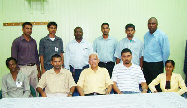 Members of the Neal and Massy Sports Club executive committee pose with Neal and Massy Group Chief Executive Officer Deo Persaud (centre front row), newly elected President Dinanauth “Dave” Sharma is second from (right front row).