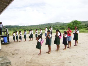 Prayers before school: Students of the Arau Primary School pray before going to write their exams. 