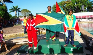EUREKA! I’ve Got it.Noelle Smith (center) got Guyana’s first gold medal of the 2008 Goodwill Championships in the girls’ 13-14, 50m freestyle event yesterday at Castellani Pool. Smith placed first ahead Suriname’s Ruby-Ann Redjopawiro (right) and Trinidad’s Simone Maundy. (Lawrence Fanfair photo)