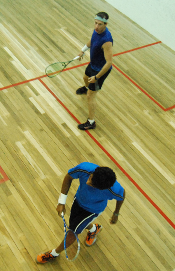At home, but alone Kristian Jeffrey (foreground) defended his home turf against Barbadian Mark Sealey last night at the Georgetown Club, becoming the lone Guyanese to advance to the quarter finals in the men’s category of the 2008 Southern Caribbean Squash Championships. 