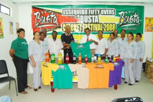 Managing Director of Guyana Beverages Incorporated Robert Selman hands over one of the jerseys to president of the Essequibo Cricket Board (ECB) Alvin Johnson as other executives of the ECB and GBC look on. (A Lawrence Fanfair photo)