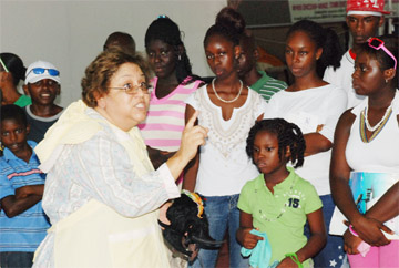 Nancy stories: Storyteller Auntie V of the Cayman Islands works her magic at the Sophia exhibition site yesterday sharing an Anancy story with the public. (Jules Gibson photo)