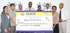 Guyana Cricket Board (GCB) president Chetram Singh (second left) receives the sponsorship cheque from Clico’s sales and marketing manager Venita Bovell (second right) as other executives of Clico (Guyana) Limited look on in appreciation. (Photo by Lawrence Fanfair) 