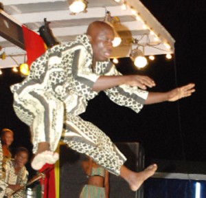 This Grenadian dancer jumps high.