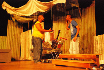 The two actors Quincy Brown (standing) and Fritz McPherson doing their thing on stage.