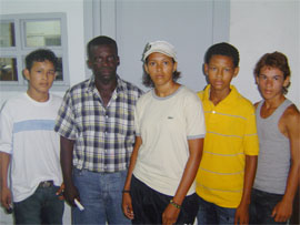 Alicia Marques stands third from right with former national boxer and coach Mark Yaw (second left) along with upcoming boxing champions Benjamin Henry (far left), Jim Oselmo (far right) and Christopher Rowe (second right).   