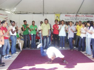 I like to move it, move me: This young man hits the floor to perform a dance move during a performance at the Carifesta Youth Village, National Park. (Iana Seales photo)