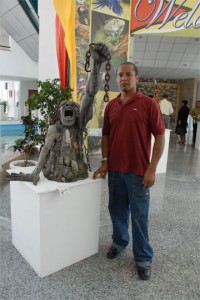 The sculpture, “Emancipation” with its artist Winslow Craig, at the National Convention Centre yesterday.  