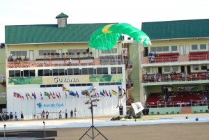 One of the parachute jumpers from the Guyana Defence Force about to land safely at yesterday’s closing ceremony at the National Stadium. 