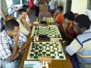 Local chess players contemplate their options during a tournament game. At second, right is junior chess player Taffin Khan, who progressed recently to the senior category. Taffin is among the leaders in the current Carifesta chess tournament, which continues today at the Kei-Shar’s sports complex in Hadfield St. National champion Kriskal Persaud is leading the tournament after four rounds. The final four rounds will be played today from 10 am.