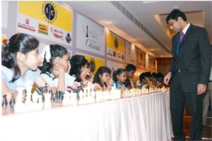World chess champion Viswanathan Anand giving a simultaneous exhibition to students in India.  A number of young girls from India are currently playing the game, and doing well on the international circuit. A few weeks ago, India won both the male and female junior world championship titles.