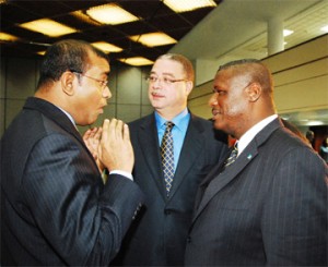 President Bharrat Jagdeo (left) in dialogue with Barbadian Prime Minister David Thompson (centre) and St Lucian Prime Minister Stephenson King yesterday in Barbados. (Barbados Nation photo)  