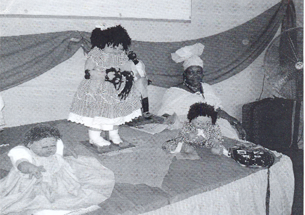 Trenita Hodge of the British Virgin Islands with some of her dolls  