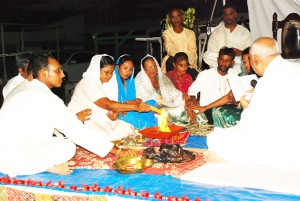 Relatives of some of the massacre victims making an offering during a Havan at the Satsang held in remembrance of the Lusignan Massacre victims last evening.  