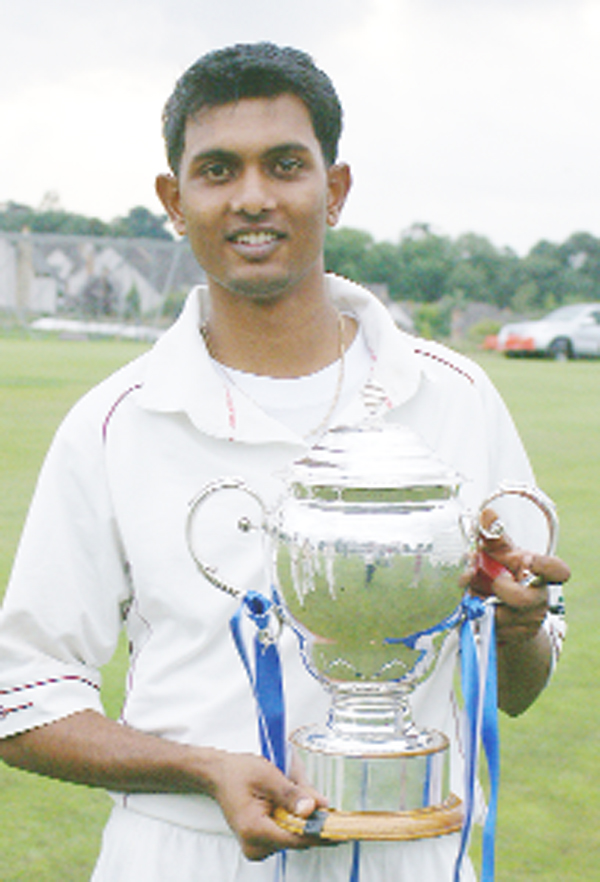 Georgetown Cricket Club player Wasim Haslim poses with the 2008 Scottish Cup after his team Ferguslie won the competition on August 24, 2008 at Bothwell Castle Policies, Scotland. 