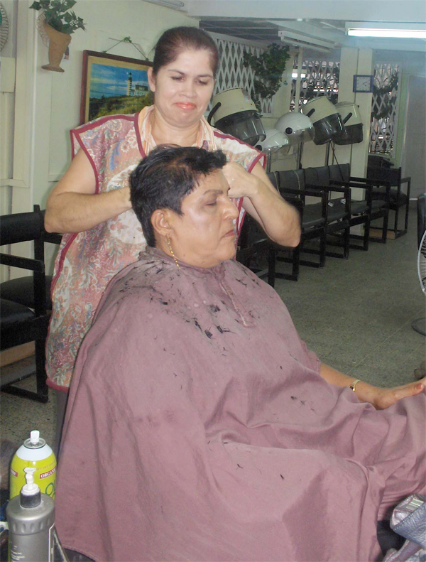 Stylist Rose cuts a customer’s hair