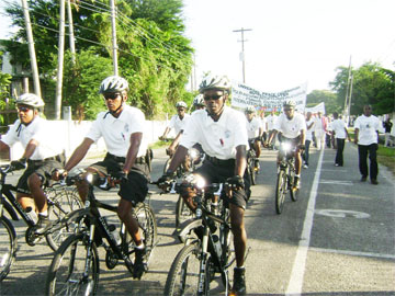 Members of City Hall’s Bicycle Patrol head the peace march which was held on Sunday by the Universal Peace Federation in collaboration with the Guyana Justices of Peace and Commissioner of Oaths Association.    