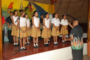 Hinterland scholarship students performing a national song during the opening ceremony of the First Regional Meeting of Indigenous Affairs and Government Authorities of the Amazon Region at the Umana Yana yesterday.     
