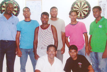 Participants in the recently held ‘Blind Draw’ darts competition at Granny Sports Bar: from left are  Bryan James, Anthony Bissoondyal, Krishna Bissoondyal, Shameer Latiff, and Afeez Majid. Stooping are national champion Norman Madhoo (left) and Vijay Roopchand.  
