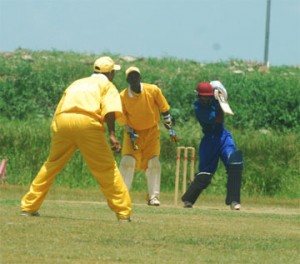 Opener Rajendra Chandrika  drives during his stroke-filled innings of 65 against Essequibo as wicket-keeper Wayne Osborne and another Essequibo player look on during their first round clash in the GCB/El Dorado-sponsored senior inter county limited overs clash at the Everest Cricket Club ground yesterday. (A Lawrence Fanfair photo)     