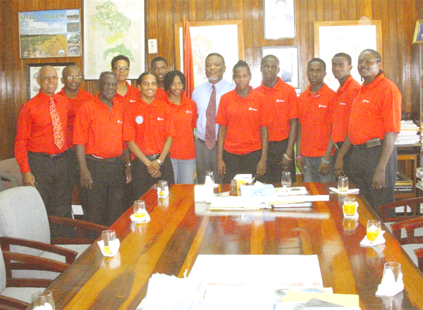 COURTESY CALL!  Members of the Junior Commonwealth Games team which paid a courtesy call on Prime Minister Samuel Hinds at his office yesterday. From left, is Affeeze Khan, Manager of the boxing team, Linden Johnson, (coach) Rudolph Torrington Boxing Official, Dr. Karen Pilgrim, Herlando Allicock, Stefan Gouveia, Michelle John, Hinds, Ambrose Thomas, Akeem Alexander, Nigel Bryan, Clevon Rocke and coach Carl Franklyn. Missing is national table tennis player Trenace Lowe. 