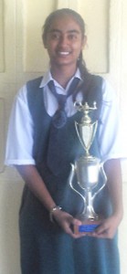 Ahila Singh poses with her trophy for topping the Region Three CSEC Examination.