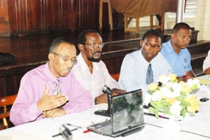 Commissioner Keith Burrowes (left) clarifies a point yesterday. Members of the panel (from left to right) are councillor Ranwell Jordan, union representative Andrew Hicks, and Mahindra Ishri of the Ministry of Local Government.         