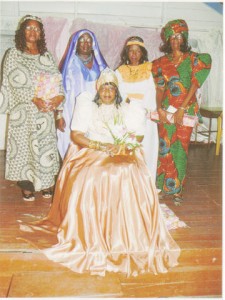  The Queen of Sheba, Shirley Lewis, seated on her throne. Standing from left to right are: first runner-up, Claudette Ralph, second runner-up, Pamela Hutson, third runner-up Claudia Harris and the fourth runner-up Patricia Mitchell. 