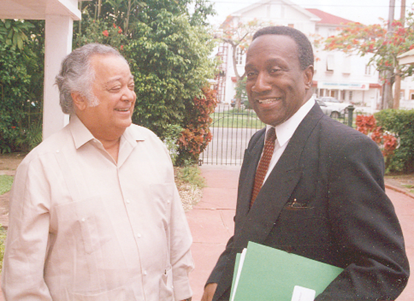 Sir Shridath in conversation with Caricom Secretary-General Edwin Carrington in the garden of Colgrain House, 2002 (Stabroek News file photo)