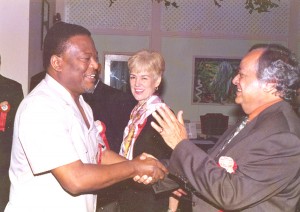 Sir Shridath greets Prime Minister Samuel Hinds.  (Stabroek News file photo)