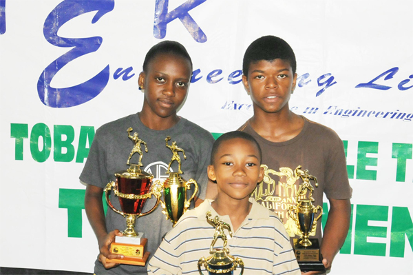 Tobago Open trophy winners. From left Trenace Lowe and Denzil Hopkinson with Kyle Edghill, (front) display the spoils won last weekend in Trinidad. (Photo courtesy of Harold Hopkinson           