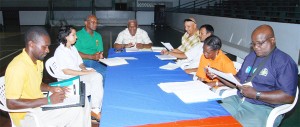 Hard at work, the local planning committee for the IGG yesterday at their weekly meeting at the Cliff Anderson Sports Hall. (Lawrence Fanfair photo)       