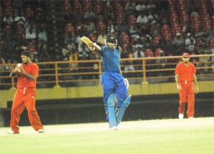 He’s the Man. Demerara’s Christopher Barnwell acknowledges the applause of his teammates after reaching his half century against Berbice in the Inter-County limited overs final at the Guyana National Stadium, Providence Friday night. Berbice skipper Narsingh Deonarine is at left and Assad Fudadin right. (Lawrence Fanfair photo) 