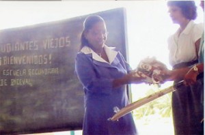 Headmistress Cheryl Dos Santos receives part of the donation from Koomarie Doobay Gaymes