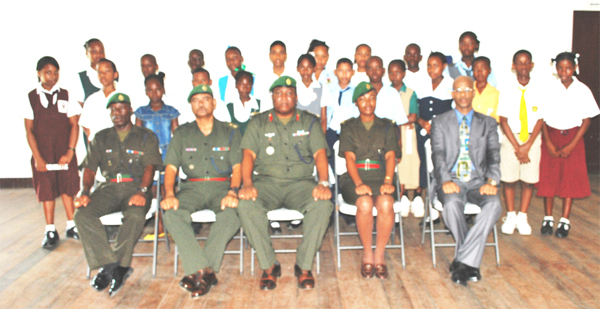 Bursary awardees with senior army officers. Colonel Mark Phillips is seated third from left.