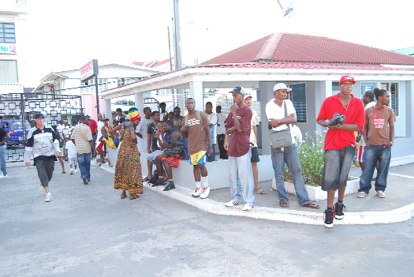 Basketball players and spectators mill around outside the hospital as the news of Worrell’s untimely death spread. (Lawrence Fanfair photo)  