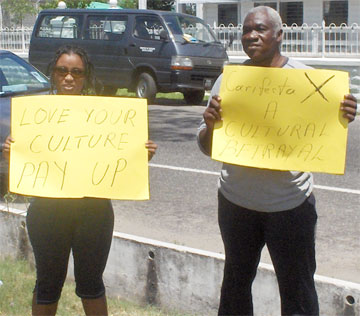 Sonia Yarde and Godfrey Naughton protesting yesterday. 