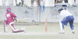 Demerara Cricket Club (DCC) and national under-19 opener Trevon Griffith sweeps to leg during his entertaining innings of 20 against Malteenoes Sports Club yesterday at the DCC ground Queenstown. The wicketkeeper is former national under 19 player Delroy Jacobs (An Aubrey Crawford photograph)  