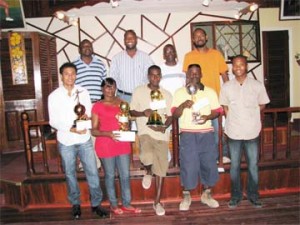 Entertainment Source Futsal winners show off their prizes along with Banks DIH representatives Troy Peters extreme left (back row) and Mortimer Stewart, second from left.
