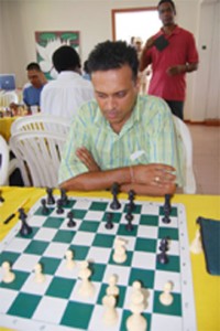 Shiv Nandalall is all concentration. Nandalall is one of three leaders after yesterday’s play. (Photos by Lawrence Fanfair)        