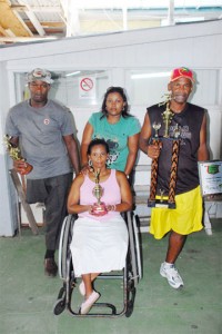 US Bound! From left, Amputee-walker, Dennis Burns, Audrey Bowlin (in wheelchair), chaperone and guide Gillian Hassanah and William France.