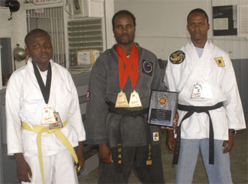 In this Aubrey Crawford photo, Allende Barker (L), Sensei Troy Bobb (C) and Tyrone Niles pose with the prizes they won at the Pan Caribbean International Martial Arts Championships in Trinidad and Tobago recently.     